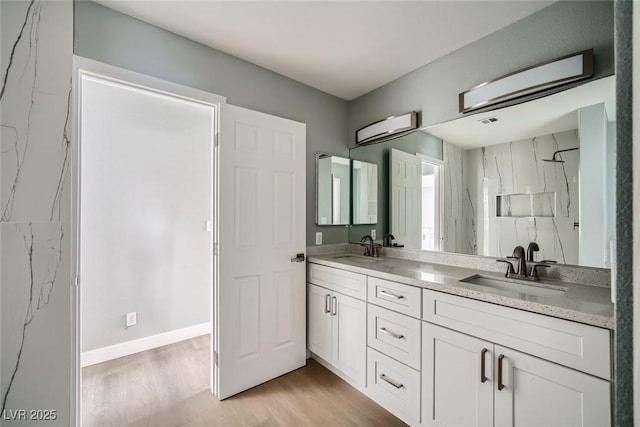 bathroom featuring vanity and wood-type flooring