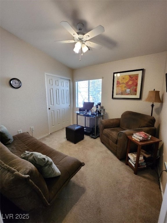 carpeted living room featuring ceiling fan