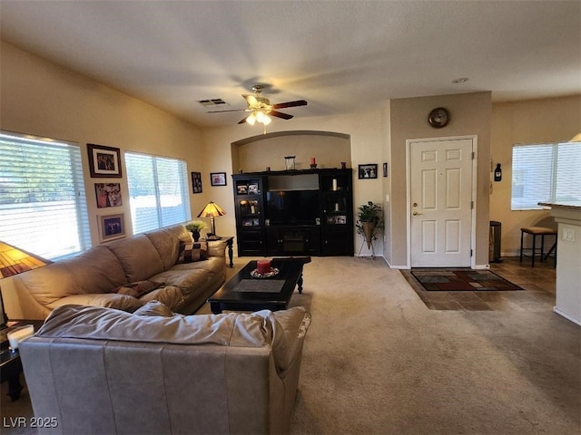 carpeted living room featuring ceiling fan