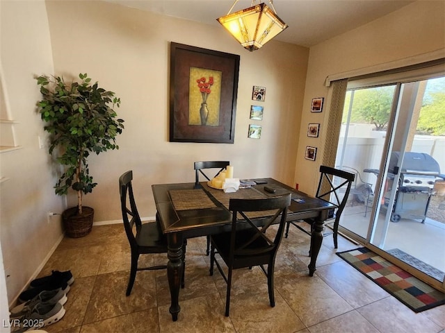 dining room featuring light tile patterned floors