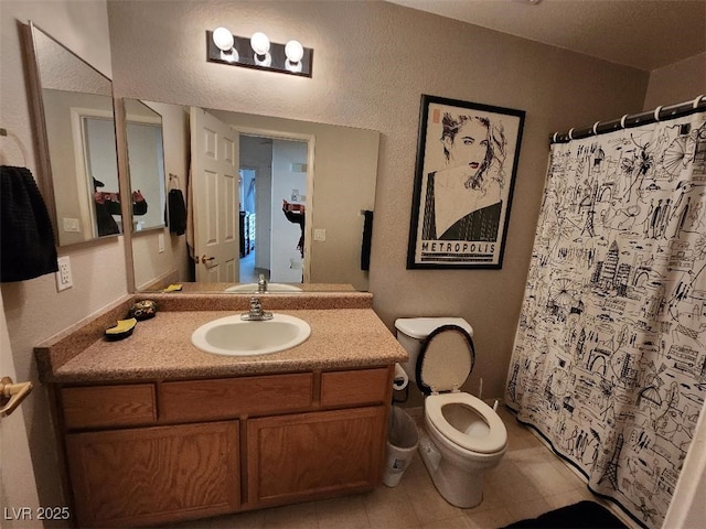 bathroom featuring vanity, toilet, and walk in shower