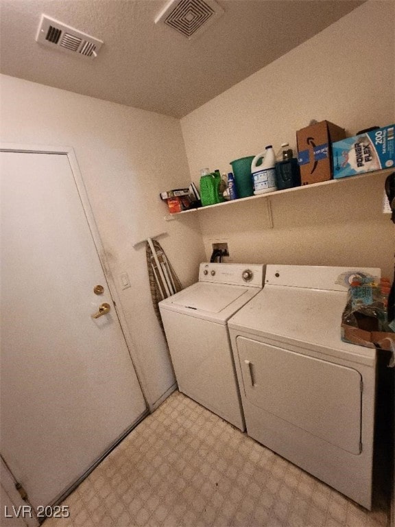 clothes washing area featuring washing machine and dryer