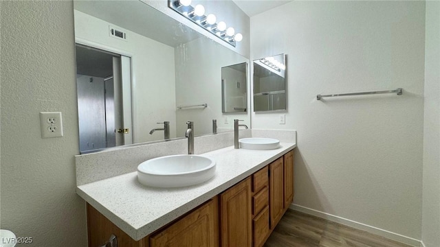 bathroom featuring vanity and hardwood / wood-style floors