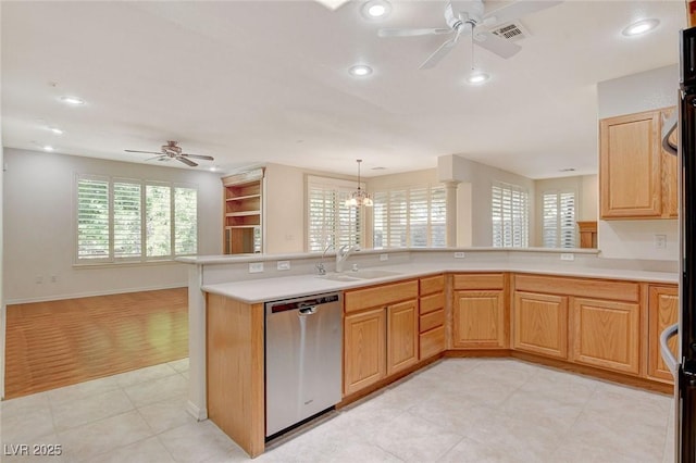 kitchen featuring plenty of natural light, sink, stainless steel dishwasher, and kitchen peninsula