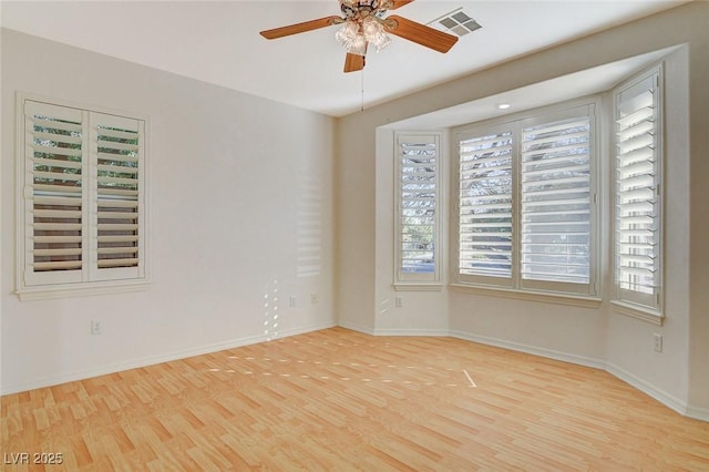 unfurnished room featuring light hardwood / wood-style flooring and ceiling fan