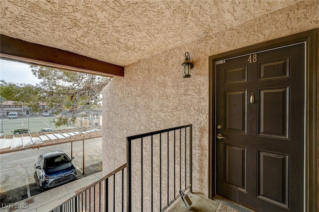 doorway to property with a balcony