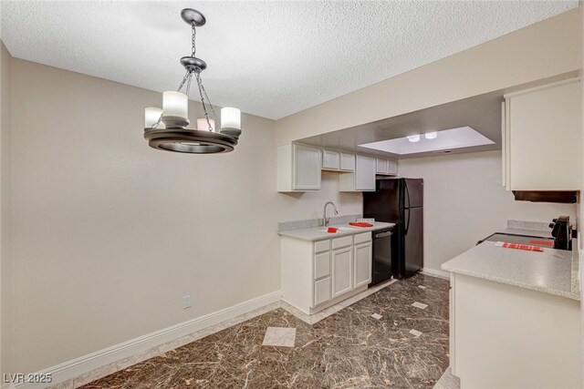 kitchen with pendant lighting, white cabinets, a textured ceiling, and black appliances