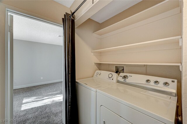 laundry area with separate washer and dryer, carpet flooring, and a textured ceiling