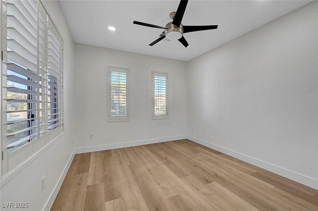 unfurnished room with ceiling fan and light wood-type flooring