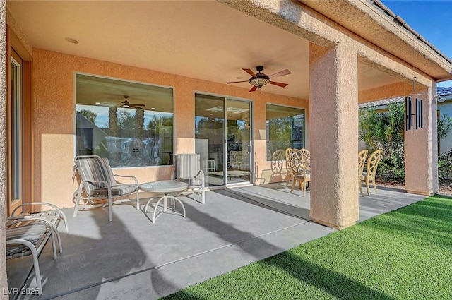 view of patio / terrace featuring ceiling fan