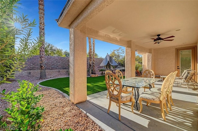 view of patio / terrace featuring ceiling fan