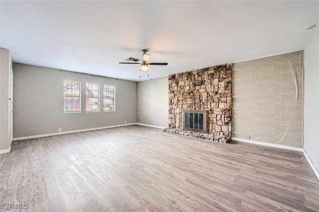 3954 Edgemoor Way, Las Vegas, NV 89121 - unfurnished living room featuring ceiling fan, wood finished floors, and a fireplace