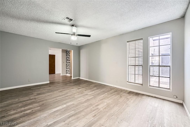 3954 Edgemoor Way, Las Vegas, NV 89121 - spare room with wood finished floors, healthy amount of natural light, a textured ceiling, and ceiling fan