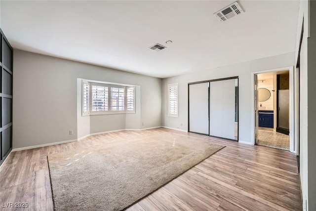 3954 Edgemoor Way, Las Vegas, NV 89121 - unfurnished bedroom featuring light wood-style floors, a closet, and ensuite bath