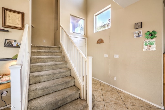 stairs featuring tile patterned floors