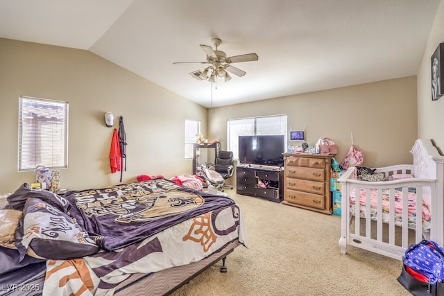 carpeted bedroom with lofted ceiling and ceiling fan