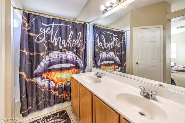 bathroom featuring vanity, shower / bathtub combination with curtain, and tile patterned flooring