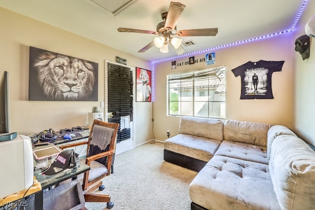 office space with ceiling fan and carpet