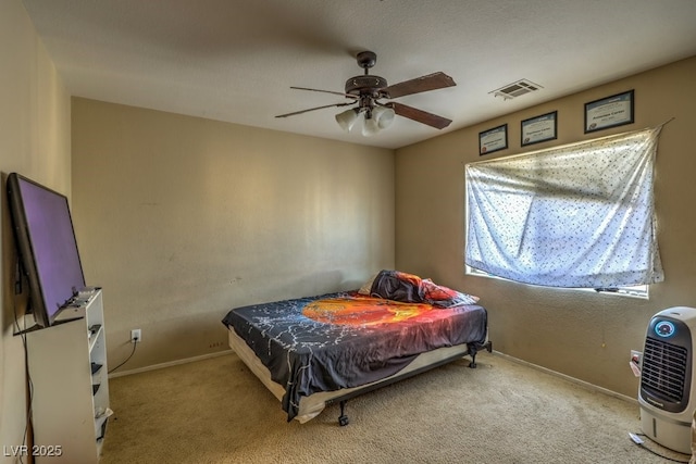 carpeted bedroom with ceiling fan