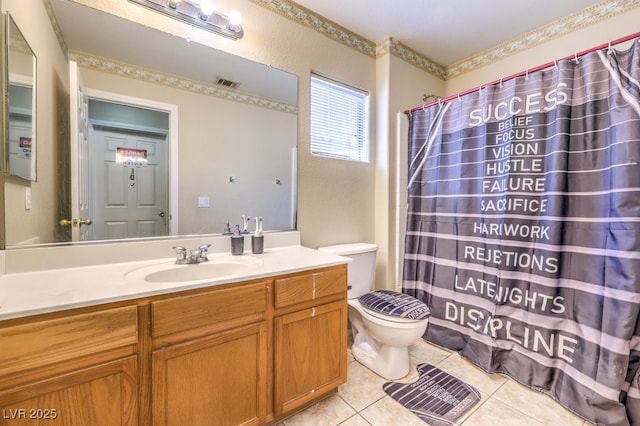 bathroom featuring vanity, tile patterned floors, and toilet