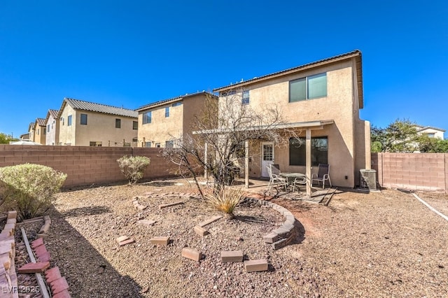 back of property featuring a patio area