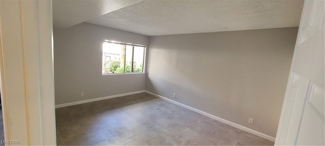 empty room featuring a textured ceiling