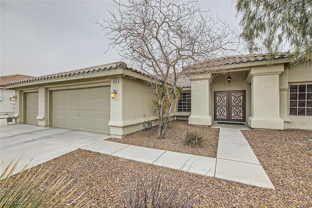 mediterranean / spanish house featuring a garage