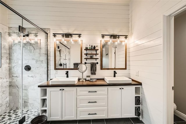 bathroom featuring vanity, tile patterned flooring, a shower with shower door, and toilet