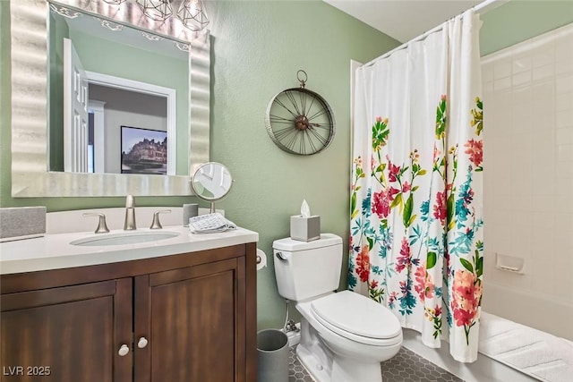 full bathroom featuring shower / bath combination with curtain, vanity, and toilet