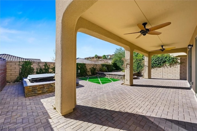 view of patio with grilling area, an outdoor kitchen, and ceiling fan