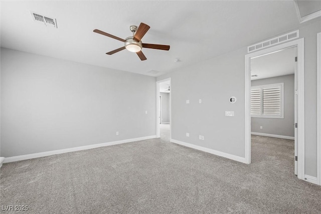 unfurnished room featuring light colored carpet and ceiling fan