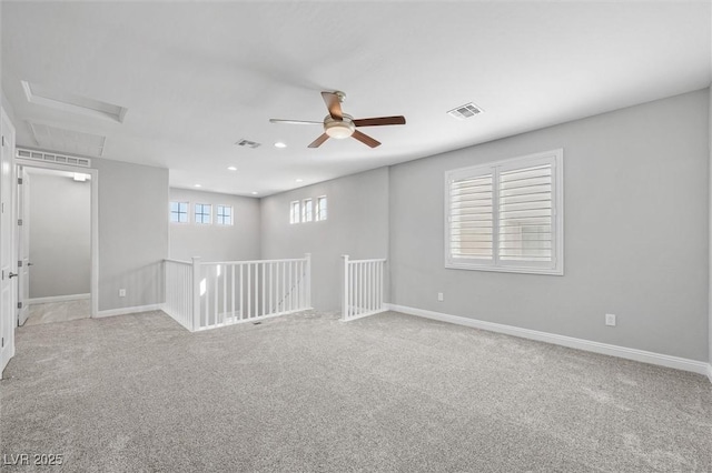 carpeted empty room with ceiling fan