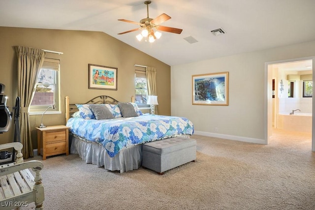 bedroom featuring lofted ceiling, carpet flooring, connected bathroom, and ceiling fan