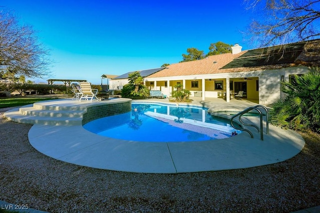 view of swimming pool with a patio area