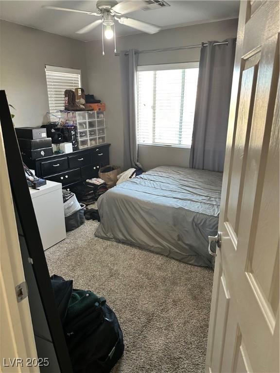 bedroom featuring ceiling fan and carpet flooring