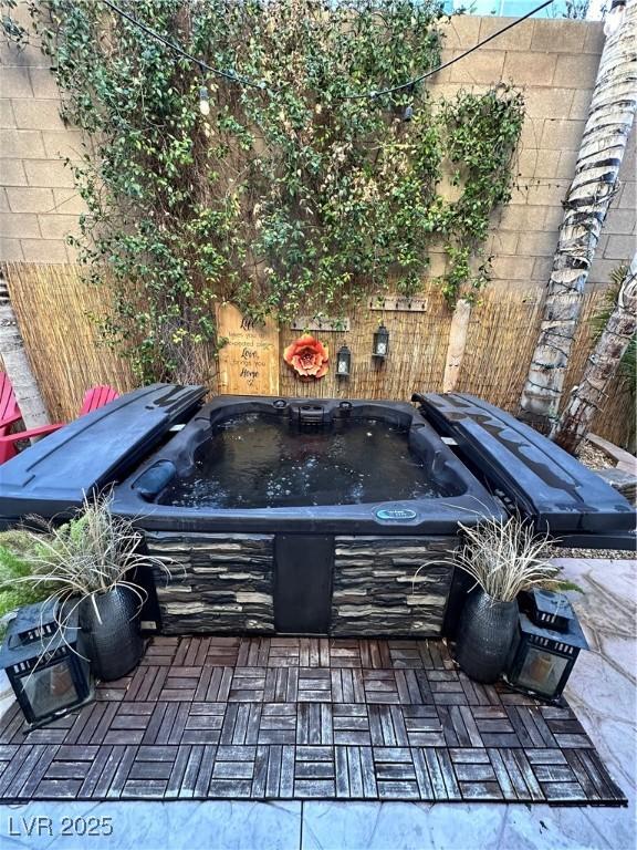 view of patio / terrace featuring a hot tub