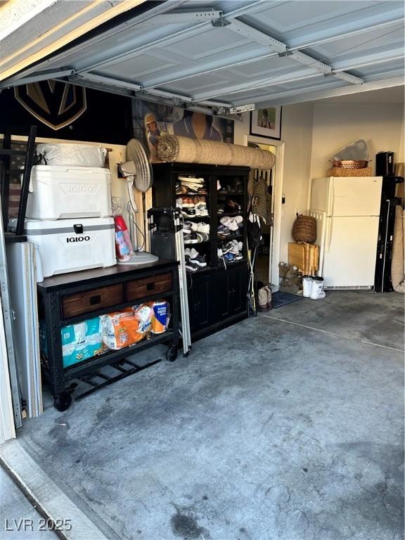 garage featuring white fridge