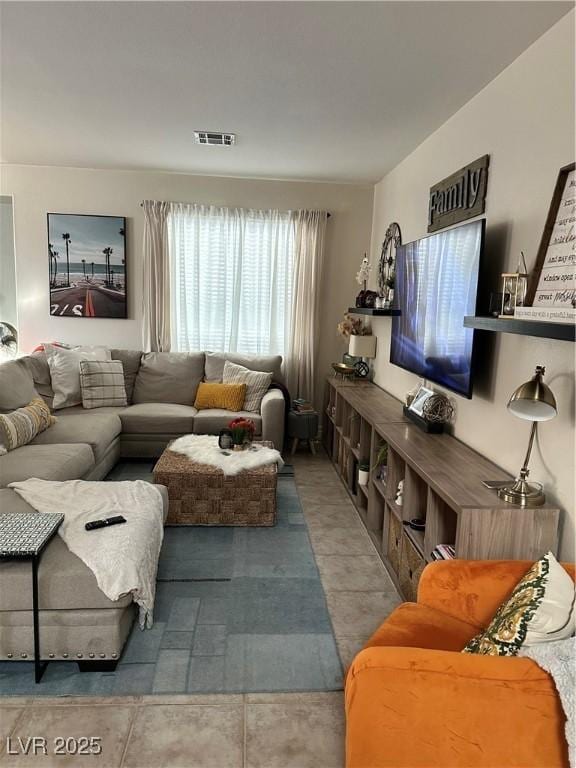 living room featuring light tile patterned floors