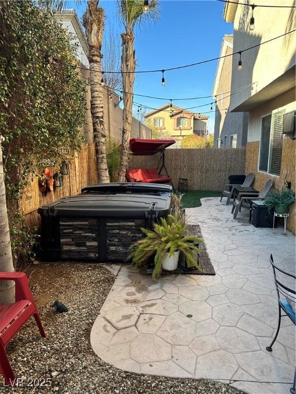 view of patio with a hot tub