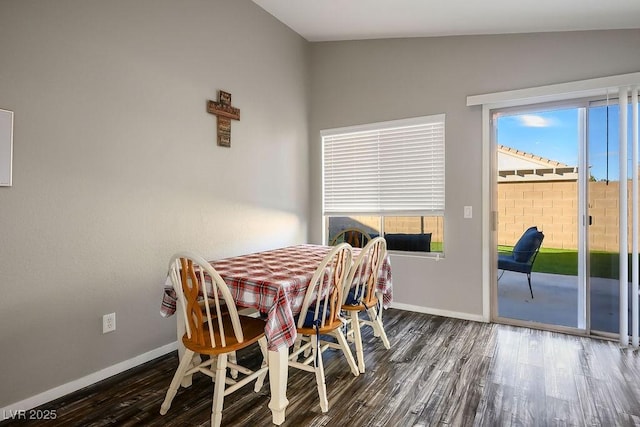 dining room with dark hardwood / wood-style floors and a healthy amount of sunlight