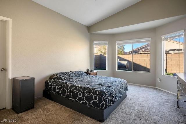 carpeted bedroom featuring lofted ceiling