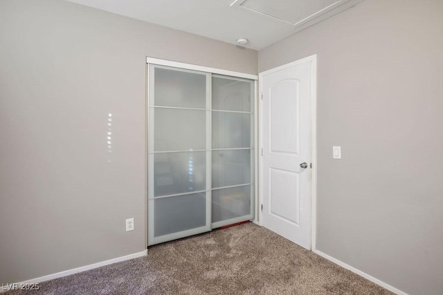 unfurnished bedroom with carpet floors and a closet