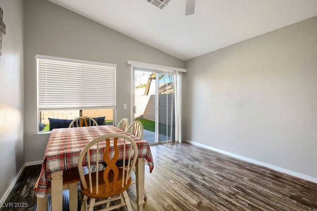 dining area with lofted ceiling, hardwood / wood-style floors, and ceiling fan