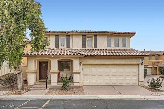 mediterranean / spanish-style house with a garage