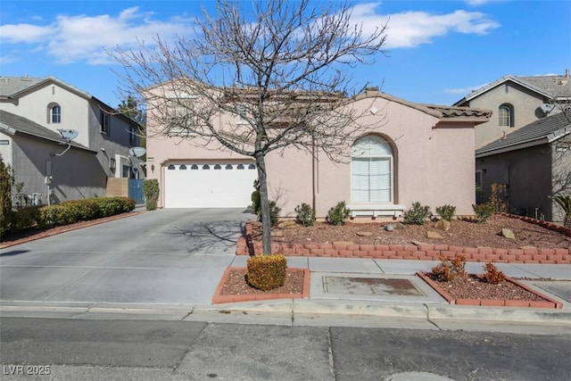 mediterranean / spanish house with a garage