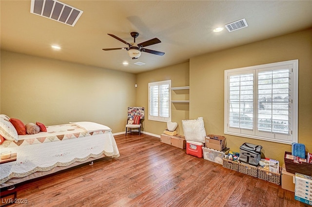 bedroom with wood-type flooring and ceiling fan