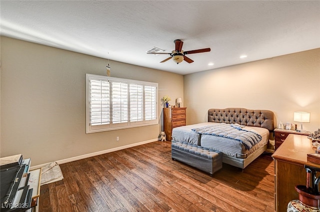 bedroom with dark hardwood / wood-style floors and ceiling fan