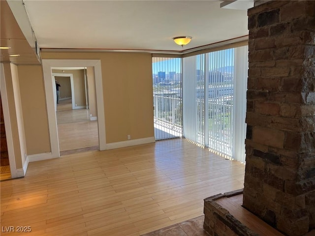 interior space with expansive windows and light wood-type flooring