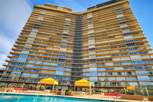 view of swimming pool with a gazebo and a patio