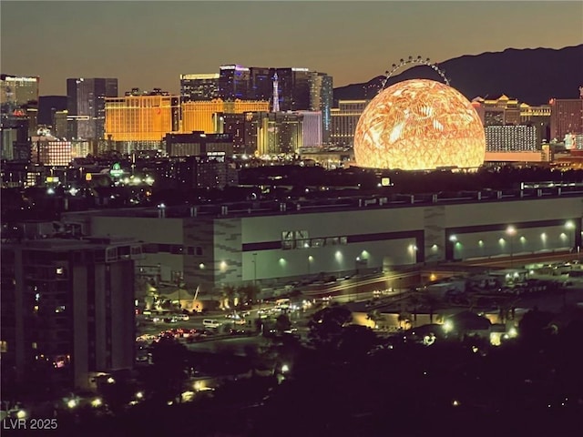 property's view of city with a mountain view